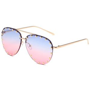 Retro pilot sunglasses with gold metal frame, gradient lenses, and rivet detailing on edges