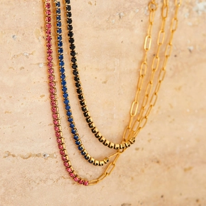 Three gold PVD stainless steel necklaces with zircon stones in pink, blue and black