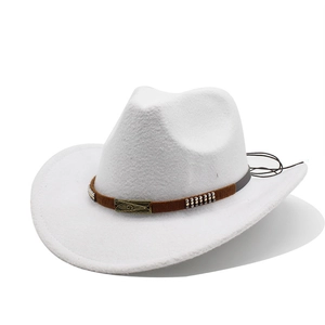 Detail of white wool jazz hat featuring vintage bronze metal plate and brown woven band