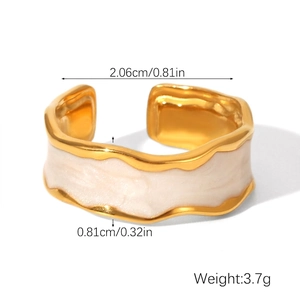 Detail view of irregular gold wavy ring with marble white enamel inlay and dimensions