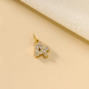 Macro shot of gold number 4 pendant accessory with sparkling crystal rhinestones