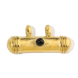 Detail of vintage gold stainless steel cylinder pendant with black gemstone inlay
