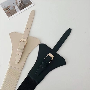 Detail of beige and black wide elastic belts with PU leather and metal buckle hardware