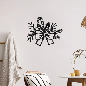 Modern black Christmas wall decal featuring candy cane and bow silhouette on white wall