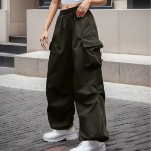 Women's olive green cargo pants in loose straight-leg fit with street style pockets
