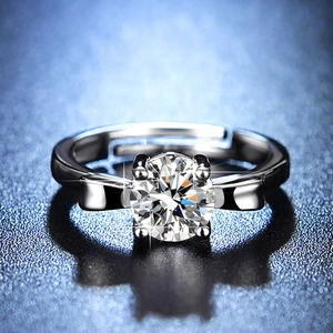 Macro shot of 1ct round moissanite ring with bow-knot detail and adjustable band
