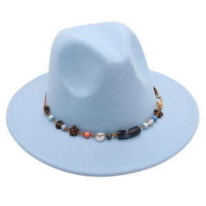 Detail of light blue fedora with bohemian beaded band featuring wood flower accents