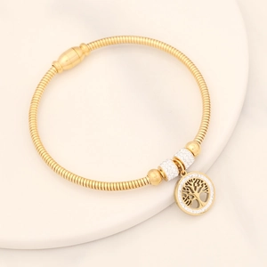 Detailed view of golden snake chain bracelet with Tree of Life pendant and crystal beads