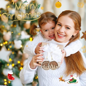 Close-up of wooden Christmas nativity ornaments held by family with festive background