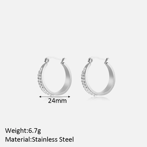 Detail view of 24mm silver stainless steel hoop earrings with double row crystals