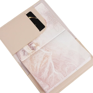 Detail view of beige passport holder interior with card slots and faux leather texture