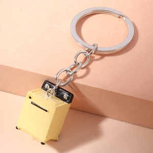 Macro shot of creative washing machine keychain pendant on minimalist props