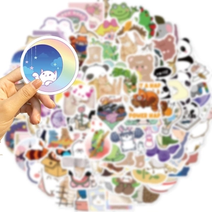 Close-up of waterproof cute cartoon cat sticker with soft background blur