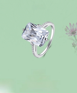 Macro detail of S925 sterling silver ring with emerald cut zircon and hallmark