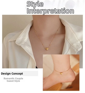 Detail view of 18K gold plated heart pendant necklace and matching anklet on model