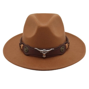 Detail view of western felt hat featuring a silver bull head buckle and leather band