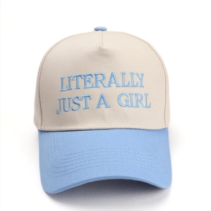 Detail of blue and beige baseball cap with Literally Just A Girl embroidery