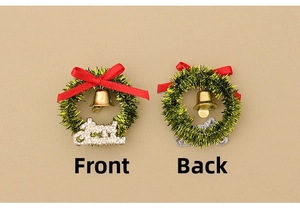 Front and back view of a miniature Christmas wreath with red bow and gold bell detail