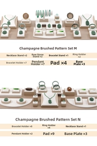 Detailed view of champagne brushed leather jewelry display sets with various stands and bases