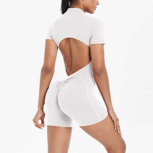 Detail view of the open-back cutout and ruched peach-butt design on white fitness jumpsuit