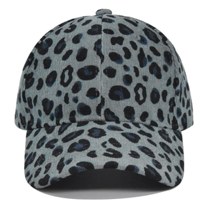 Detail view of the gray-blue corduroy baseball cap with black leopard print pattern