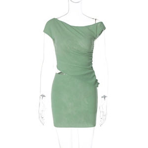 Detail of green ruched dress with asymmetric neckline and stylish waist cutout