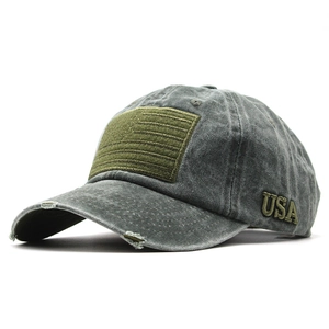 Close-up of distressed brim details and USA letter embroidery on gray washed cotton cap