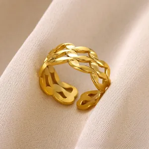 Detailed view of gold triple-layered woven hollow design adjustable open wave ring