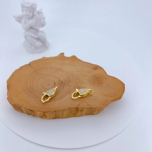 Macro shot of gold-plated teardrop lobster clasps with micro-pave cubic zirconia