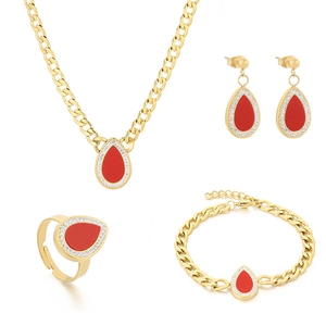 Luxury gold titanium jewelry set with red teardrop pendants and sparkling crystals