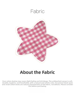 Detail of pink plaid cotton canvas fabric with natural texture and star shape design