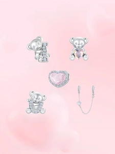 Detailed view of S925 silver bear charms and pink heart beads for DIY jewelry making
