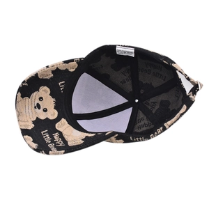 Internal detail of black bear baseball cap showing 100% polyester fabric and lining