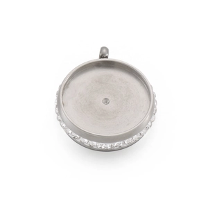 Macro detail of silver round bezel pendant with crystal rhinestones and center recess