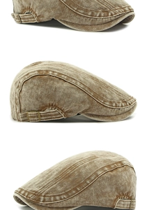Detail of vintage washed denim flat cap showing textured herringbone fabric and side buckles