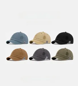 Detailed view of washed cotton baseball caps in six colors including blue and khaki