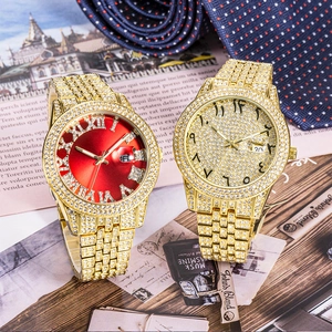 Close-up of gold iced-out watches with Roman and Arabic dials on a luxury background