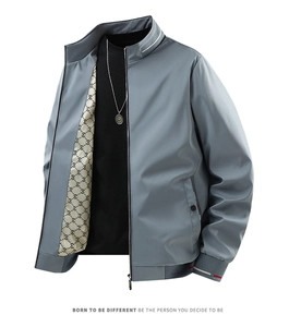 Detail of men's grey casual jacket featuring contrast striped cuffs and letter print lining