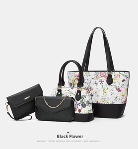 Detailed view of the 4-piece black floral tote bag set made of premium Saffiano leather