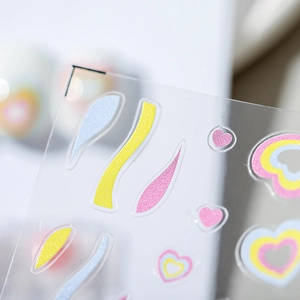 5D nail art stickers with colorful heart and wave patterns in glittery finish