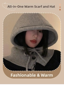 Detail of grey knitted balaclava with drawstring ties and button closure design