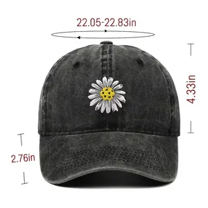 Vintage washed black baseball cap featuring daisy embroidery with detailed size dimensions