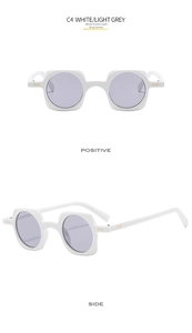 Detail of white punk sunglasses with square frame and round light grey lenses