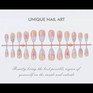 Detailed set of 24 nude press-on nails with 3D floral accents and pearl shell decor