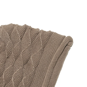 Macro detail of the textured wavy knit pattern on this warm winter slouchy beanie hat