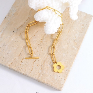 Minimalist gold link chain necklace with flower pendant and OT toggle clasp closure