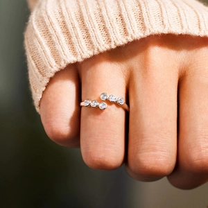 Minimalist S925 sterling silver bypass ring with six round cubic zirconia on hand