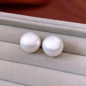 French vintage style large white pearl stud earrings with high mirror luster in jewelry box