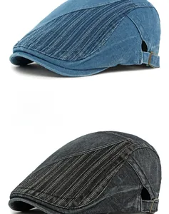 Détail de casquettes en denim avec patchwork ethnique et boucles métalliques réglables