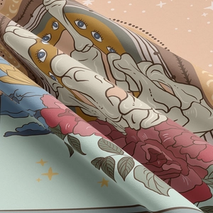 Detail of soft woven tapestry fabric showing surreal eye character and rose pattern print